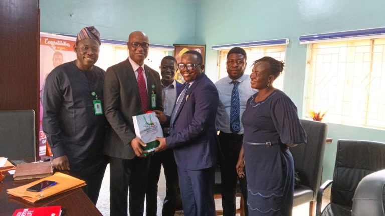 NMA Chairman presenting gift to the MD, FMC, Ikole-Ekiti